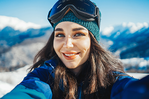Woman taking a selfie while skiing 